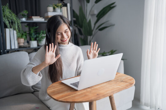 Beautiful asian young woman video call on laptop online communication Remote dating at a distance online dating.