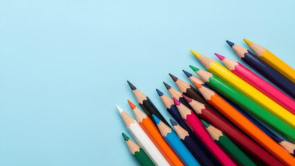 Vibrant colored pencils arranged on pastel backdrop inspire creativity and colorful learning