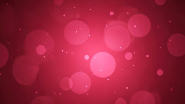 Pink and red circular bokeh lights on a dark background.