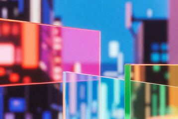 Colorful translucent neon panels layered over a blurred cityscape, creating a modern abstract look.
