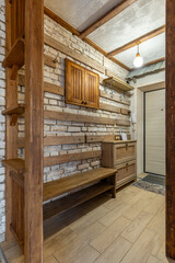 Rustic Hallway Interior with Wooden Bench and Brick Wall