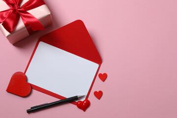 Valentine's Day card with hearts, on a pink background.
