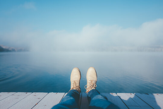 man relaxing by the lake