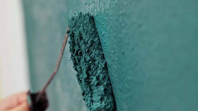 Wall painting process captured in three frames, showcasing a roller applying teal paint, with gradual zoom in on texture and technique
