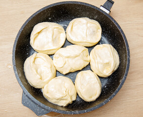A pan of doughnuts are in a pan