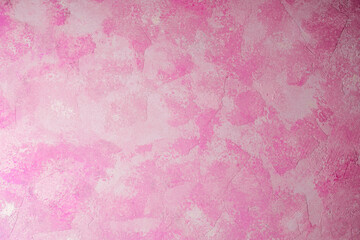 Fototapeta premium Pink abstract textured plaster wall background