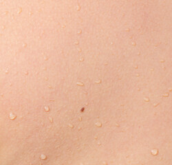 Fototapeta premium A person's back with water droplets on it