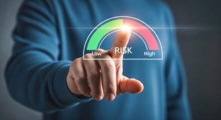 Hand of a person interacting with a digital risk gauge, displaying low to high levels, symbolizing decision-making and risk assessment in business