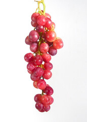 A close-up shot of a bunch of fresh, juicy red grapes, showing their vibrant color and delicate texture