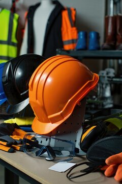 Display of construction safety equipment arranged neatly on a neutral surface.