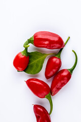 Vibrant red jalapeno pepper on a white background with space for text, ideal for food and culinary concepts.Group of ripe red jalapeno peppers .