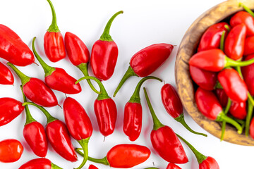 Vibrant red jalapeno pepper on a white background with space for text, ideal for food and culinary concepts.Group of ripe red jalapeno peppers .