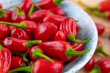 Vibrant red jalapeno pepper on a white background with space for text, ideal for food and culinary concepts.Group of ripe red jalapeno peppers .