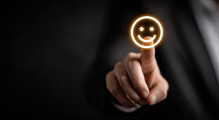 Illuminated smiley touched by finger on dark background