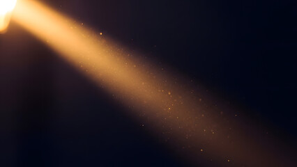 Abstract golden light beam with floating dust particles effect