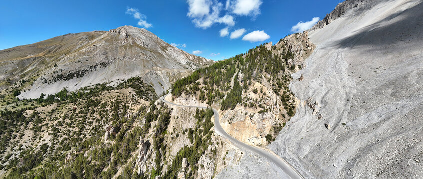 Winding mountain road crossing the French Alps at Col d'Izoard, Hautes-Alpes, France, Europe.