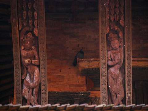Detailed Traditional Newari Erotic Wooden Strut on a Temple, wooden architectural design or carving of Bhaktapur Durbar Square UNESCO site, Nepal.