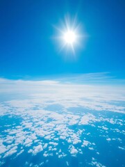 Vibrant blue expanse with soft, scattered white clouds under a brilliant sun,  bright sky,  serene