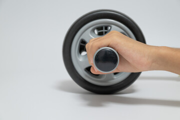 Closeup of hand gripping the handle of an ab wheel