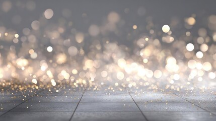 Soft focus abstract background with shimmering golden bokeh lights and a textured stone floor