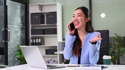 businesswoman talking on the phone while working on her laptop in a modern office, showcasing communication, professionalism, and a positive work - Powered by Adobe