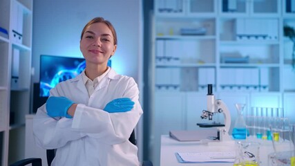 Portrait of Caucasian female scientist in white lab coat in laboratory.  - Powered by Adobe