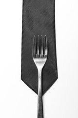 A black tie and a fork