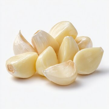 peeled garlic cloves on a white background