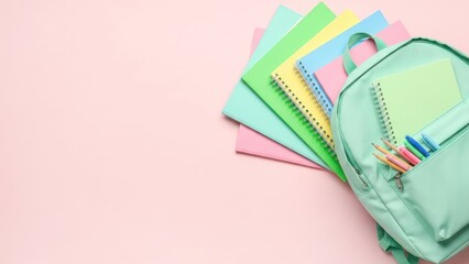 Pastel Color Arrangement of Backpack with School Supplies on Pink Background