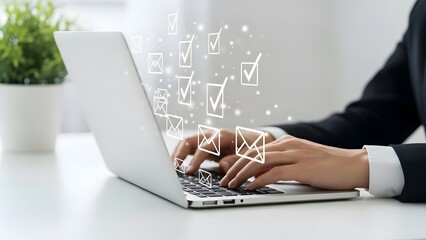 Business professional typing on laptop with abstract letters floating above keyboard