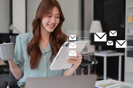 Email notification concept, Female use smartphone and laptop receive message alert in the mailbox.