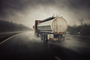 Tanker truck on highway in bad weather