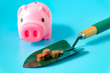 Gardening shovel with piggy bank.