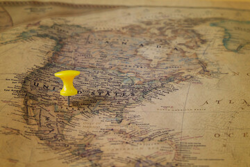 The color pins on old map,point on location.