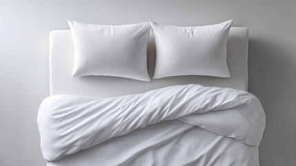 Minimalist clean white bed in bedroom providing comfortable rest, relaxation, and peaceful sleep with soft pillows and duvet, top view