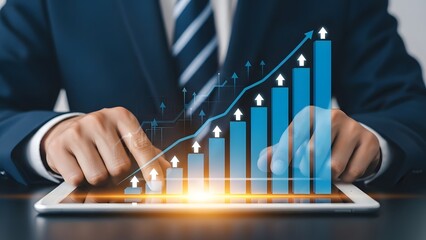 Businessman analyzing growing financial data on tablet with positive trend graph