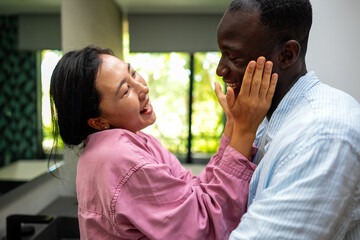Happy diverse couple enjoying meaningful moments together, embracing love, connection, and joy