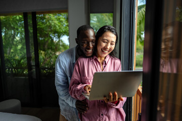 Man and woman working remotely using laptop. Male female freelancers working together. Digital nomad