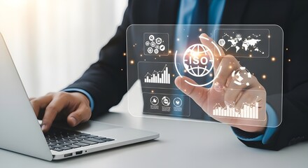 Businessman interacting with futuristic digital interface and laptop for data analysis