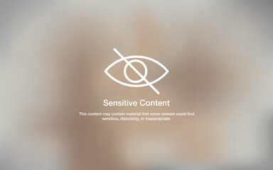 A blurred background featuring a sensitive content warning icon and message, commonly used for marking restricted or mature material online. Sensitive content warning. Digital content filter.