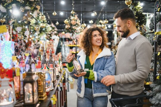 Couple shopping for christmas decorations in store