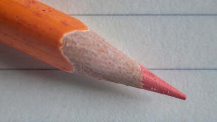 The texture of a sharpened orange pencil lead revealed