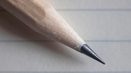 Macro shot of a wooden pencil’s graphite tip