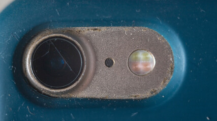 Camera module in used condition: dust, smudges, minor damage