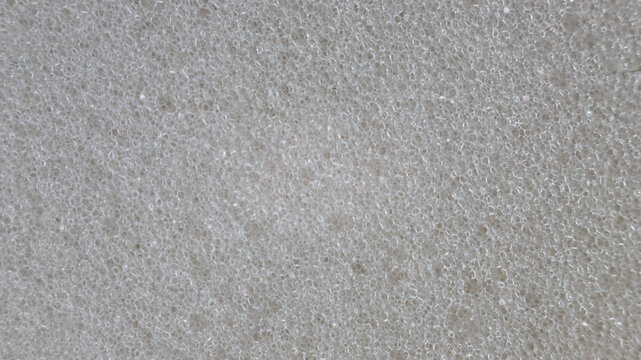 Close-up of light grey foam material texture