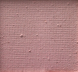 Detailed texture of matte pink eyeshadow