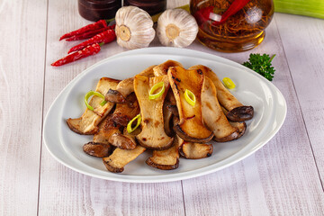 Roasted eringi mushrooms in the plate