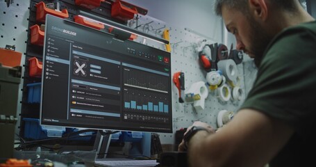 Engineer Programming FPV Drone Parameters on Computer Software. Man Configures and Programs Drone Using Specialized Software Showing 3D Model. Digital Configuration and Fine Tuning For Optimal Flight.
