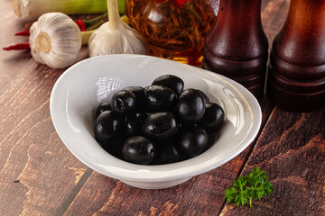 Mediterranean marinated Black olives in the bowl