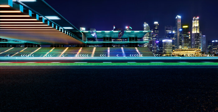 3d rendering empty racing circuit stands at night city - Powered by Adobe